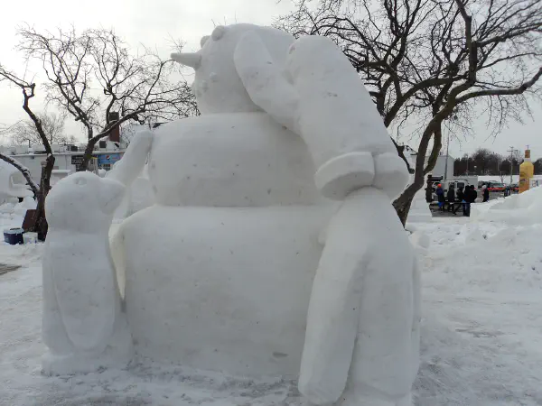 Penguins Building a Snowman snow sculpture